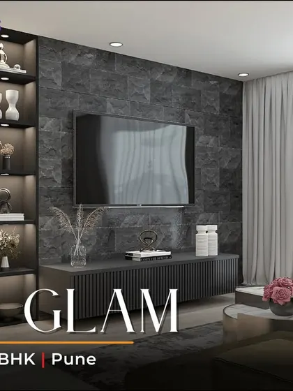 The TV unit in the 'Zen Glam' living room, with a ribbed console, backlit display cabinet, and a Ganesha idol.