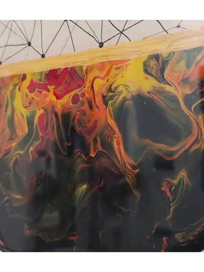 The fiery colors in this resin pour look like flames or a sunset. I love the abstract and unpredictable nature of fluid art.