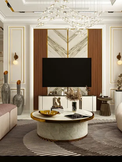 A close-up of the TV unit from a neoclassical living room design. The combination of a marble-top coffee table, geometric rug, and a stunning chandelier creates a layered, luxurious feel.