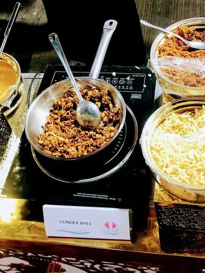 This is a live counter for Dryfruit Goond Bhel, a unique winter dessert. We mix edible gum (goond) with dry fruits, fresh khoya, and serve it warm with a jaggery and pistachio sauce.