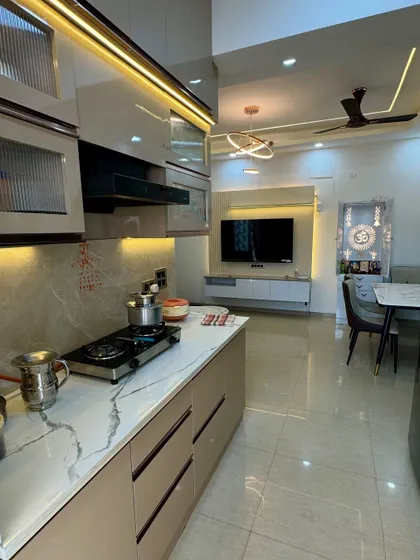 This shot shows the open-concept design, with a view from the kitchen into the living and dining area. This layout is great for families who like to interact while cooking.