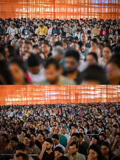 Thousands of participants listen with rapt attention during the Patanjali Yoga Sutras conference. The collective focus and thirst for knowledge create a powerful learning environment.