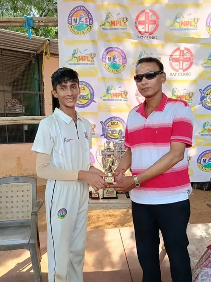 A player from our victorious U-17 MPL team being awarded his trophy.