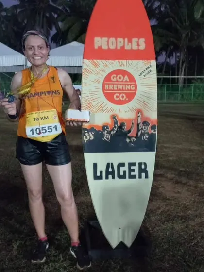 Posing with my prize after securing 2nd place in the open women's category at the Goa River Marathon 10K.