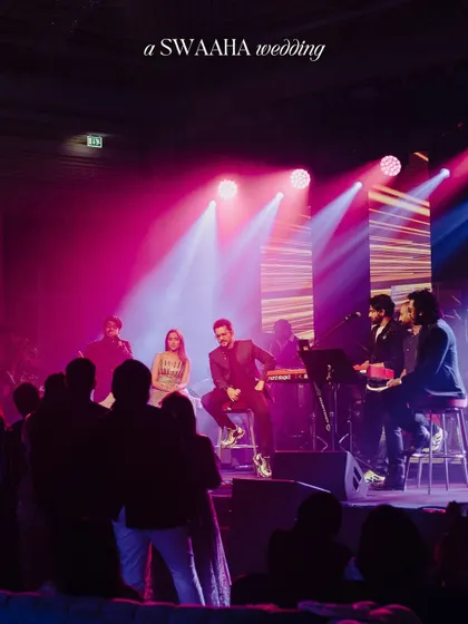A live band performance on stage, with the couple joining the artists for an intimate, unplugged session, creating a personal and memorable musical moment.