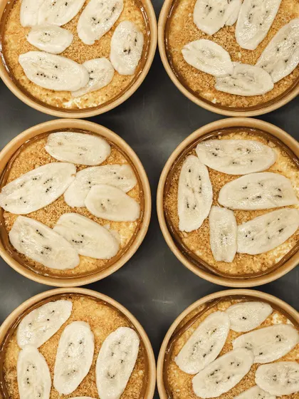 An overhead view of our Banoffee Pies, ready for their next layer of creamy goodness.