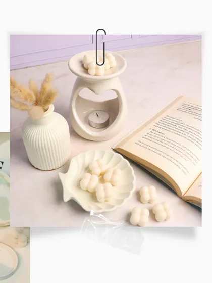 A beautifully styled shot of our heart diffuser and cloud-like blob melts, perfect for a Rakhi gift.