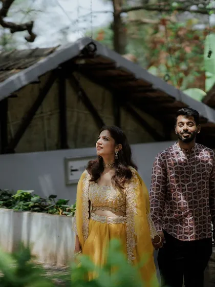 The couple taking a stroll through the beautiful, rustic venue.