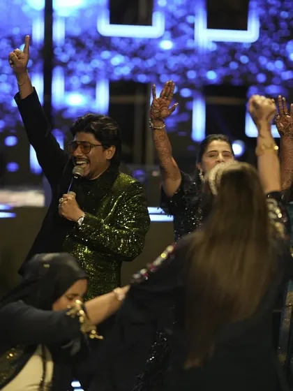 The grand finale of a Sangeet night, with everyone on stage celebrating together. This is the kind of joyful chaos I love to create.