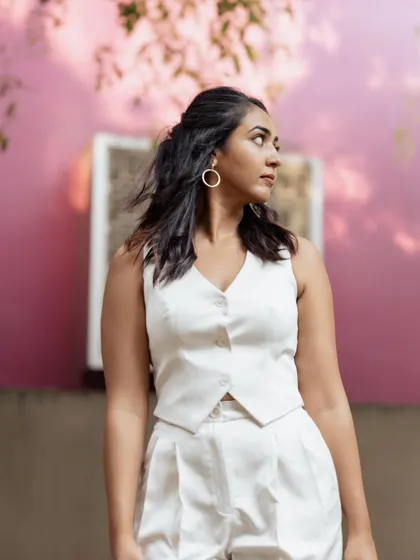 The lovely Hitha Chandrashekar looking chic and powerful in a custom white waistcoat and trouser co-ord set.
