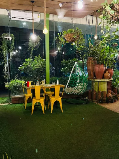 This corner with the swing chair is one of our most loved spots. It's perfect for sinking into with a book or just enjoying a quiet moment by the large glass window overlooking the greenery outside.