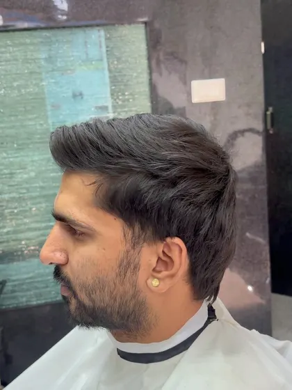 A classic taper fade. This is a timeless haircut that is always a great choice.