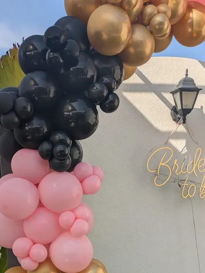 A close-up detail of the balloon arch and the elegant 'Bride to be' neon sign, perfect for daytime or evening celebrations.