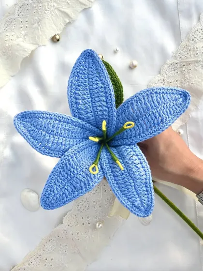We are all different flowers from the same garden. This single, large blue crochet lily is a testament to unique beauty.