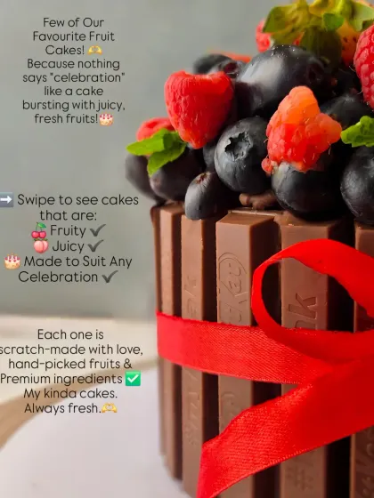 A close-up of a KitKat cake, showcasing the abundance of fresh berries on top. I believe in using hand-picked fruits for the best taste.