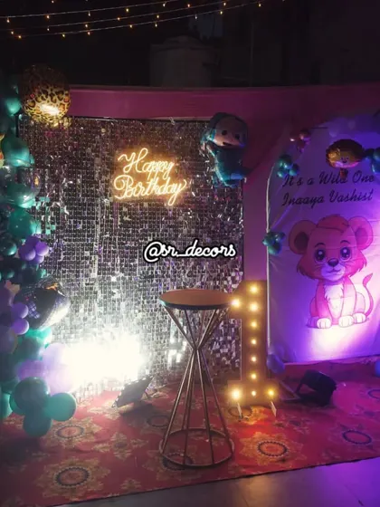 The 'Wild One' setup under different lighting, creating a magical forest ambiance for the celebration.