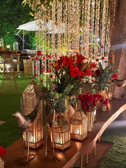 Another detail shot of the red and gold table decor, featuring our signature bird accents.