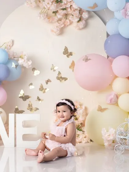A wide view of the beautiful pastel butterfly setup, with the "ONE" letters prominently displayed.
