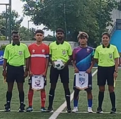 The team captains with the match officials before the coin toss.