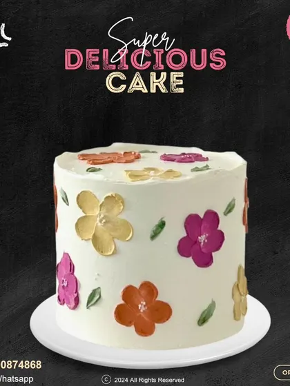 A lovely cake with a hand-painted floral design. The warm, earthy tones of the flowers create a rustic and artistic feel, perfect for a sophisticated and understated celebration.