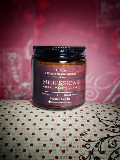 The 'Impressions' candle against a rich, textured background. This scent is versatile and works beautifully in any room of the house.