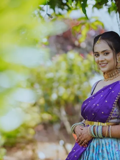 A happy client moment in our light blue and purple half saree. Her smile says it all, and we love being a part of these joyous occasions.