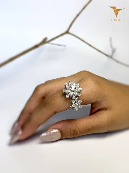Delicate as a bloom, dazzling as a diamond. This floral statement ring, with its layered petals of diamonds, is designed to make every gesture unforgettable.