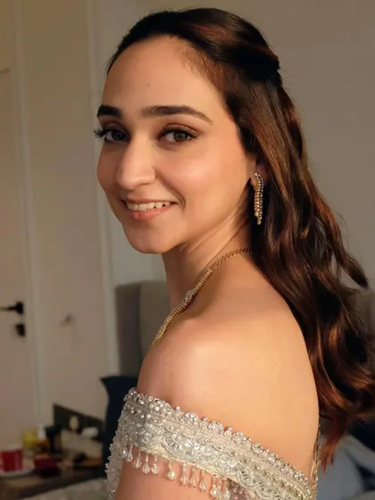 A lovely half-tie with romantic waves for a wedding guest. This style is versatile and keeps the hair off the face while still showing off its length.