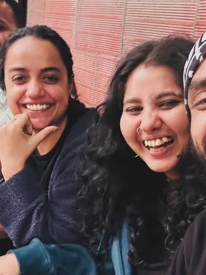 We are a community that laughs together. A candid moment of our team enjoying a break, showcasing the friendships forged at Flux.