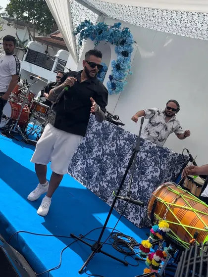 Sharing the stage with the iconic UK Punjabi singer Juggy D at a daytime wedding party in Phuket.