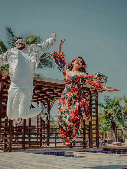 A joyful jump shot of one of the couples at their pool party. We capture the fun and carefree spirit of the celebration.