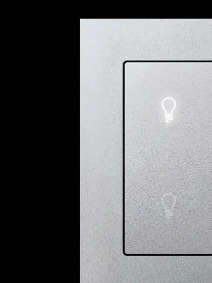 This Schneider Electric KNX push-button demonstrates minimalist design with maximum function. The subtle, backlit icons provide clear feedback for lighting control, offering an understated yet powerful point of interaction in your smart home.