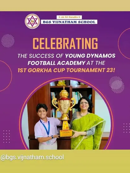 Celebrating success with our partners. A player from BGS Vijnatham School, our partner institution, proudly displays the Gorkha Cup Tournament trophy.