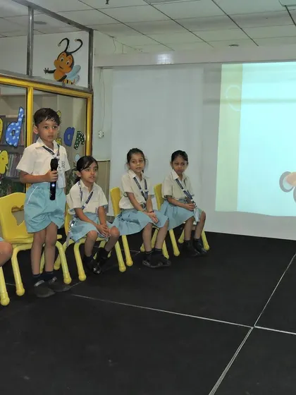 Taking turns at the microphone, students build their confidence and language skills. Our Buzzathon competition is a testament to our focus on creating articulate and self-assured communicators.