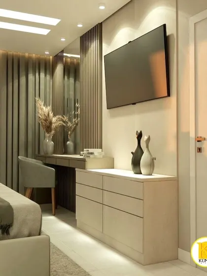 A full view of the bedroom from the previous images, showing the TV and dressing table.