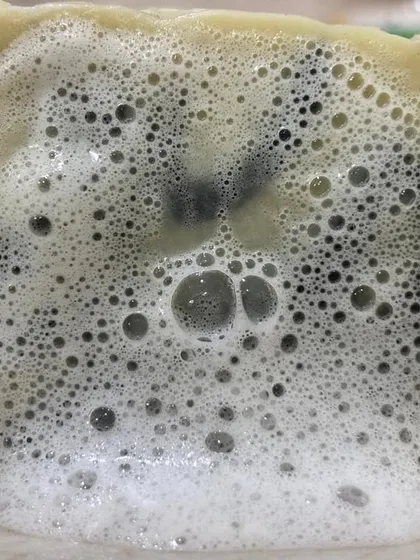 The rich, bubbly lather of our Charcoal & Dead Sea Mud Soap. It provides a deep cleanse without stripping your skin of its natural moisture.