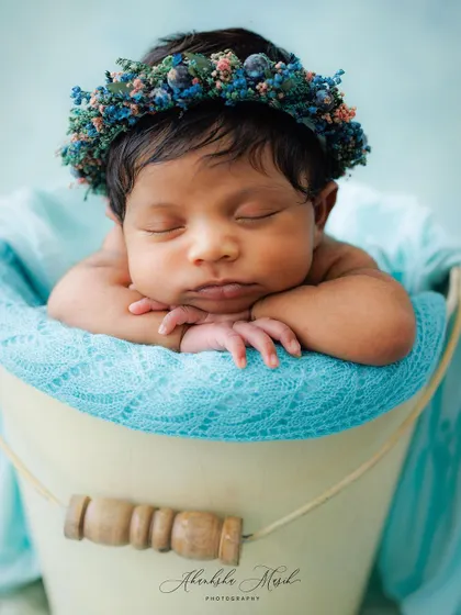A duplicate of the classic newborn in a bucket, this image remains a powerful example of my serene and timeless newborn portrait style.
