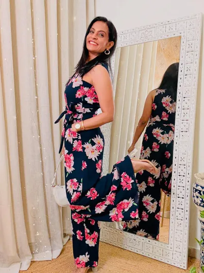 This floral print jumpsuit is a classic and pretty option. The tie-waist detail helps to define the silhouette.