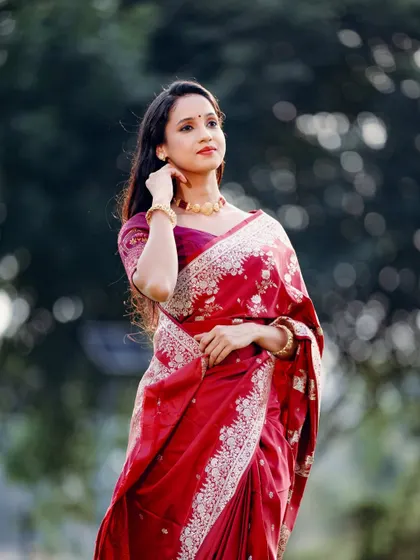 A portrait that highlights the subject's poise and the beauty of the traditional Indian attire.