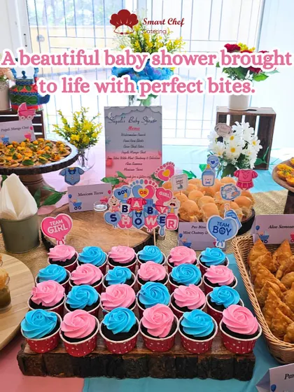 A beautiful baby shower brought to life with perfect bites. This setup features themed cupcakes, samosas, and pav bites, all decorated for a "Team Boy" or "Team Girl" reveal.