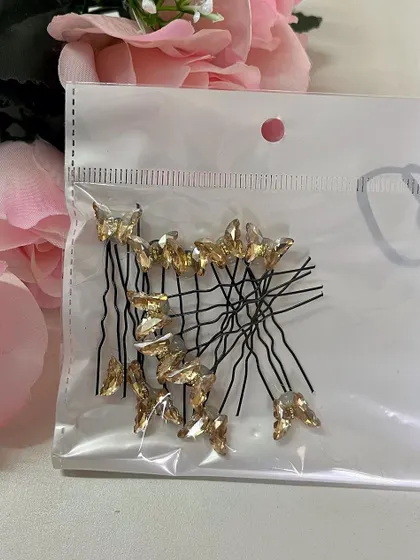 The gold crystal butterfly U-pins are perfect for a traditional look with a touch of modern glam.