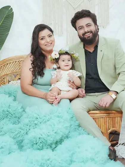 A stylish family portrait featuring one of our flowing client gowns for mom. We help you coordinate outfits for a polished and beautiful final image.