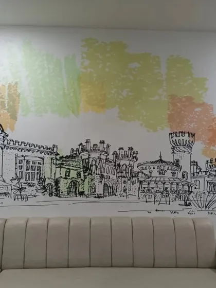 For this office lounge, I created a custom sketch-style mural of the Bengaluru cityscape. It’s a unique and artistic way to celebrate our local roots while adding a creative touch to the corporate environment.
