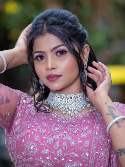 A confident portrait of the model, showing off the beautiful makeup and the sparkling rental jewellery.