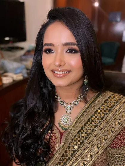 A close-up of the makeup for this beautiful bride. The soft brown smokey eye and glossy nude lip is a versatile look that suits so many occasions.