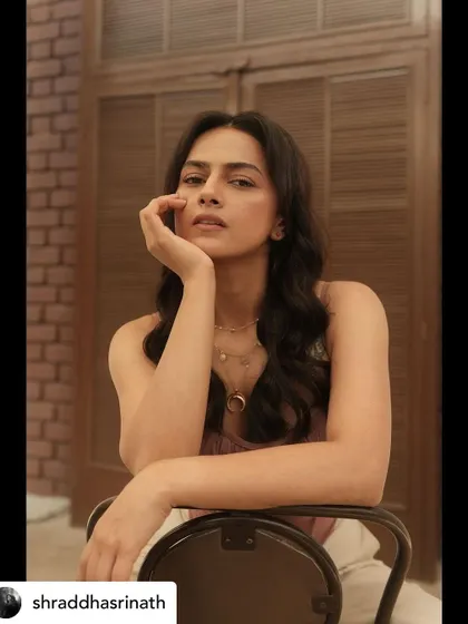 This pose highlights the soft textures of the outfit and the thoughtful, gentle mood we aimed to create for this particular photoshoot.