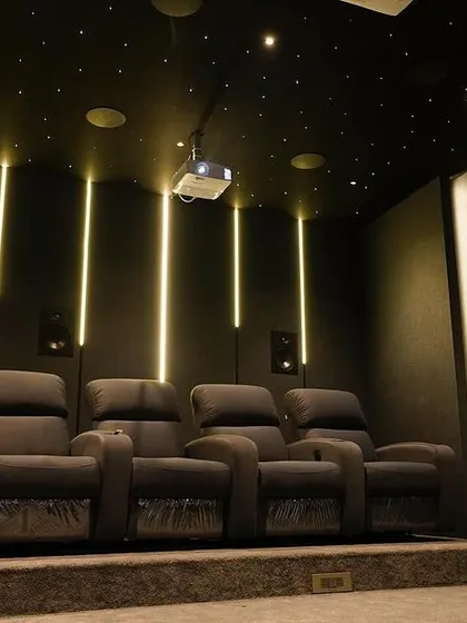 This image highlights the precise placement of the surround sound speakers and the clean lines of the acoustic panels. Every element is planned for both aesthetic appeal and optimal audio performance.