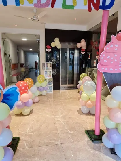 The entrance to Candyland! I use giant cupcake cutouts and pastel balloon columns to create a sweet and inviting pathway for guests.