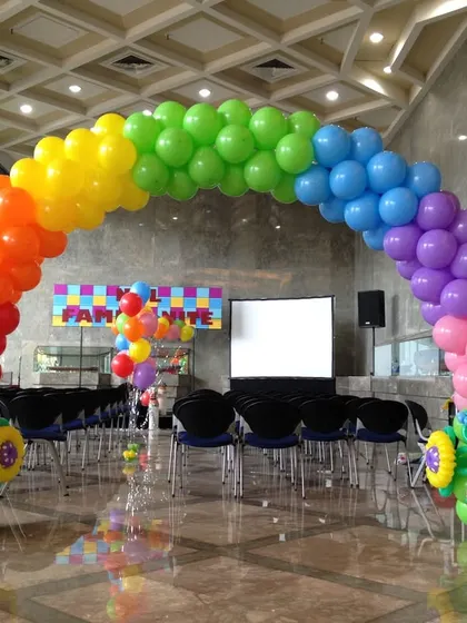A classic rainbow balloon arch, perfect for making a bright and cheerful entrance to any party or event.