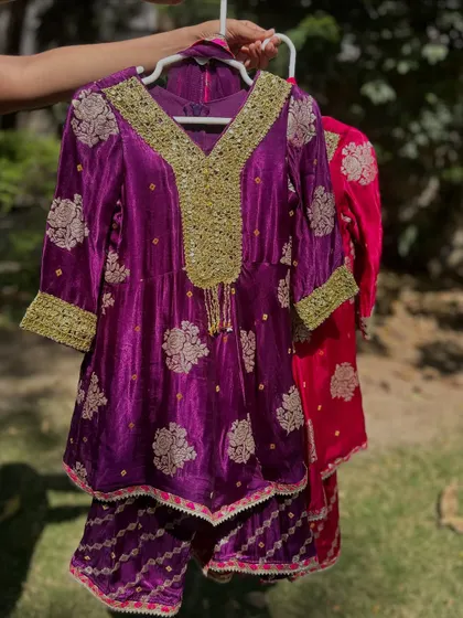 A closer look at my purple Gota Patti sharara set. The rich velvet fabric and intricate gold embroidery make it a luxurious and regal choice for any grand celebration.
